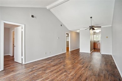 Living Room with view of Bedrooms and Kitchen
