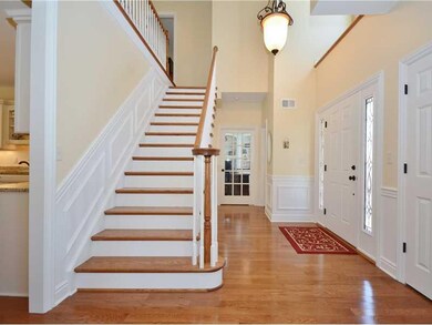 Entry/Foyer. Gleaming hardwood floors are found th