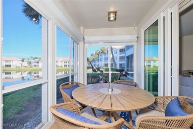 Sunroom / solarium with a water view