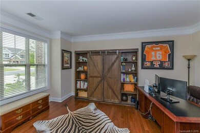 Spacious office on main level with wood floors and