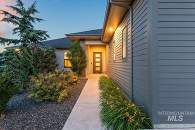 Exterior entry at dusk with roof with shingles