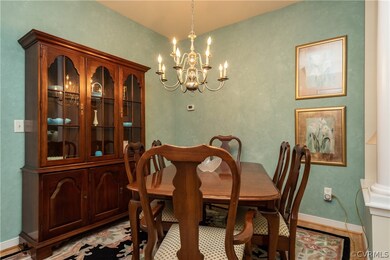 Dining Room with Hardwood Floors and Chadelier