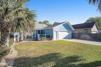 Exterior space with fence, driveway, a garage, stu