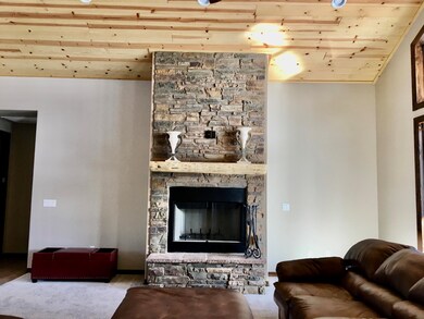 Floor to ceiling stone fireplace