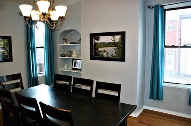 Picture windows and built in china cabinet.