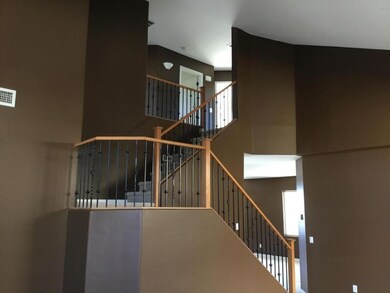 Beautiful stairwell with wrought iron!