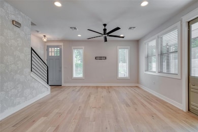 Entryway featuring visible vents, baseboards, sta