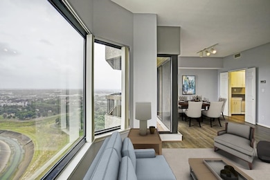 Another view of the living room and dining room.  Virtually staged.