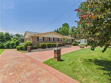 front of home - brick drive continues down the side