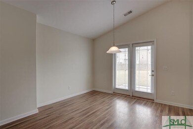 Dining area with french doors leading to back yard
