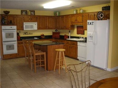 Kitchen has plenty of room to cook for all your ho