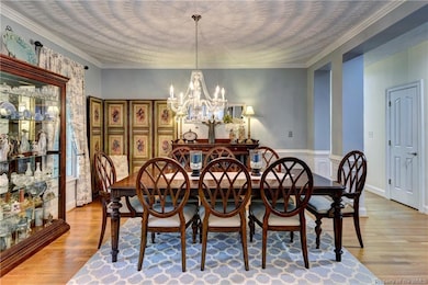 Wonderful room to entertain under the crystal chandelier