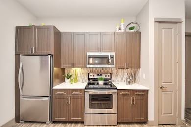 Photos are not of actual units, similar floor plan finishes, verify dimensions