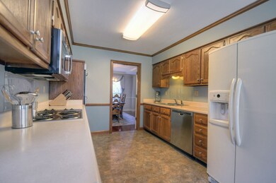 Plentiful counter & cabinet space can be found in 