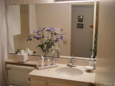 Immaculate guest bath with marble flooring