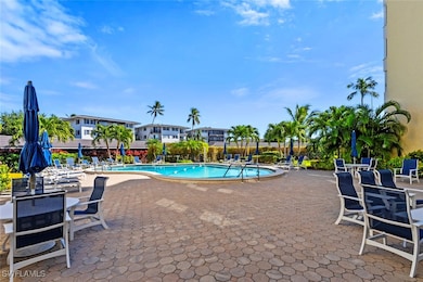 Community pool featuring a patio