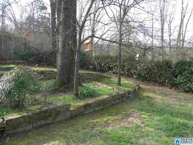Pretty stonework and garden in the backyard,