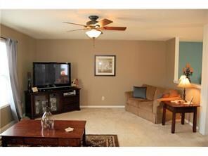 Family Room. Roomy 17x15 family room with ceiling fan is open to the living room and eat-in kitchen.  It is light and bright and can accommodate large TVs and sofas.