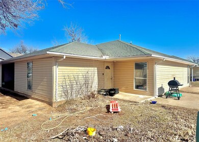 Rear view of property featuring a patio