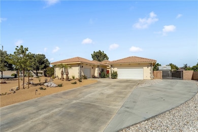 Spacious Front Yard with Zeroscape.  RV Access w Hookups, and multiple garages