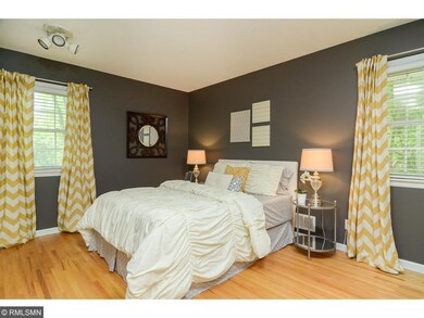 Master bathroom features hardwood floor