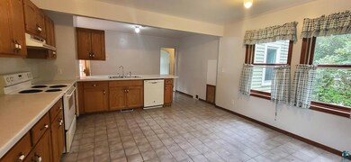 Kitchen with light tile patterned floors, plenty o