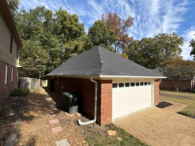 Garage featuring concrete driveway