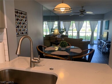 Dining area featuring ceiling fan, sink, and vinyl