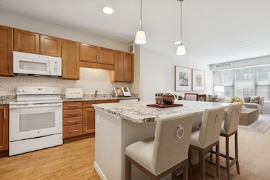 Gorgeous finishes throughout including granite, luxury vinyl plank flooring & a gleaming, upgraded backsplash! Virtually staged.