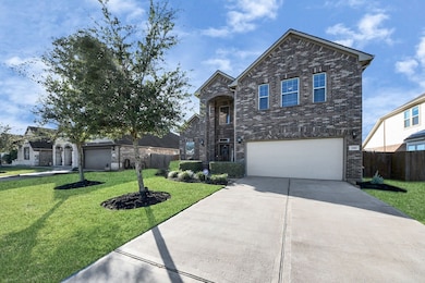 This home features two beautiful front trees and a wide double car driveway