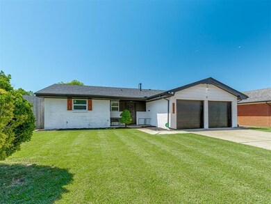 Ranch-style house with brick siding, an attached garage, concrete driveway, and a shingled roof