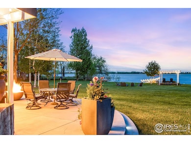 Huge patio, gas fire pit and outdoor shower. This Lakefront property offers the most peaceful setting with incredible views