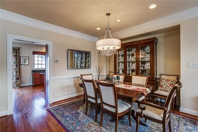 Formal Dining Room with picture frame molding, cha