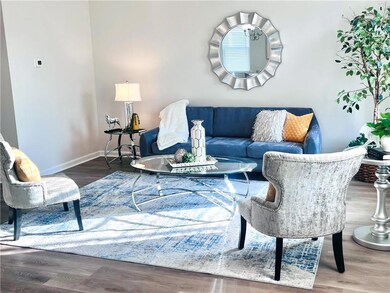 Living room with baseboards and LVP floors