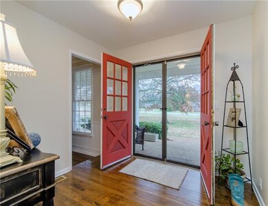 Beautiful entry foyer with sanded and finished har