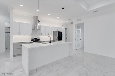 Kitchen with appliances with stainless steel finis