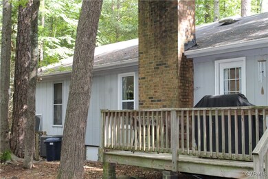 Rear view of house featuring a deck