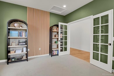 Office at front entry with french doors