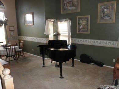 Living room and formal dining room combination wit