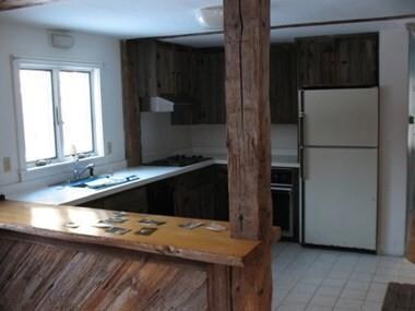 Open and sunny kitchen with tile...