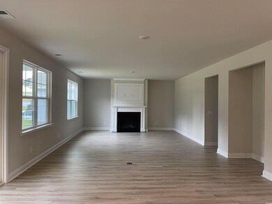 Unfurnished living room with light hardwood / wood