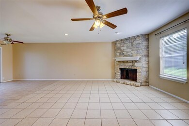 Unfurnished living room featuring ceiling fan, a 