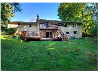 Incredible yard with large two tiered deck, covere