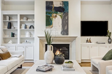 Gas fireplace with cast stone surround and built-ins.