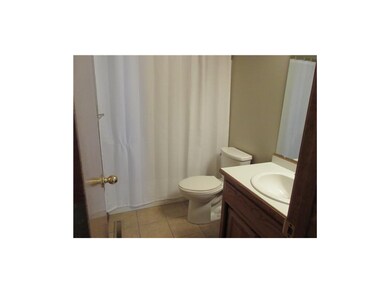 Hall bath has tile floor