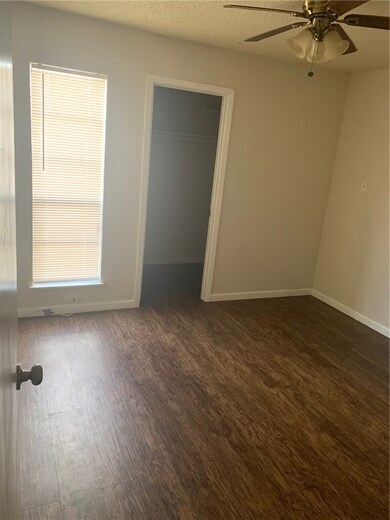 Empty room featuring wood finished floors, a ceili