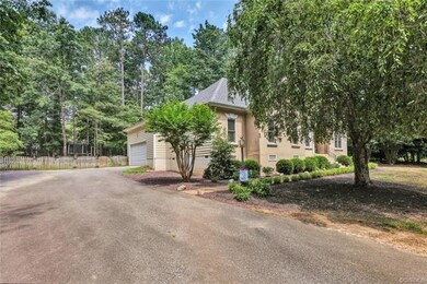 Alternate Exterior View depicting paved driveway a