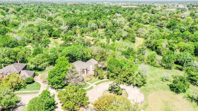 An aerial view of the home highlights the lush greenbelt and the sparse number of houses in this hidden enclave! Cowart Creek meanders through here, and you'll enjoy a short walk along the banks to Old City Park, the dog park, and the bridge leading to Stevenson Park.