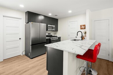 Kitchen featuring visible vents, appliances with 