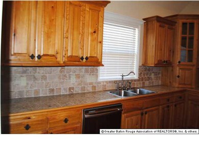 This kitchen has plenty of cabinets and lots of co